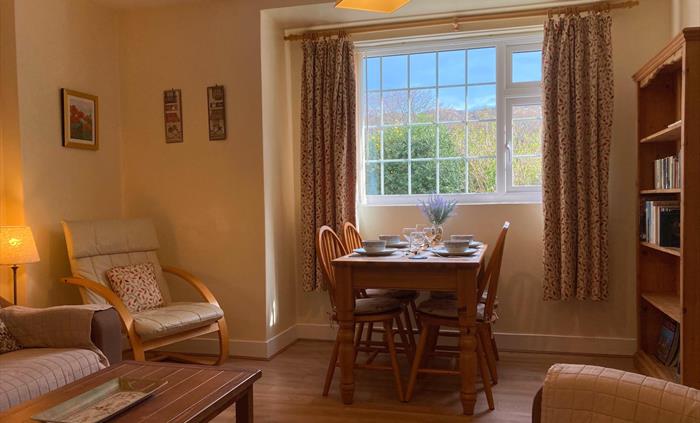 Comfy lounge and dining room. Dining table with view of the mountains